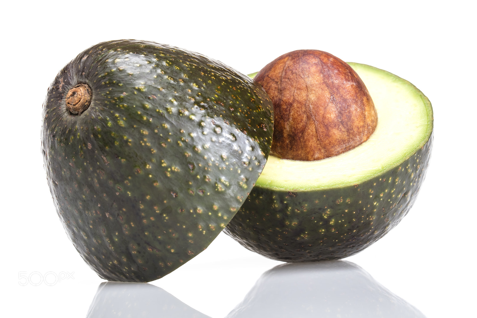 Canon EF 100mm F2.8L Macro IS USM sample photo. Avocado on white background photography