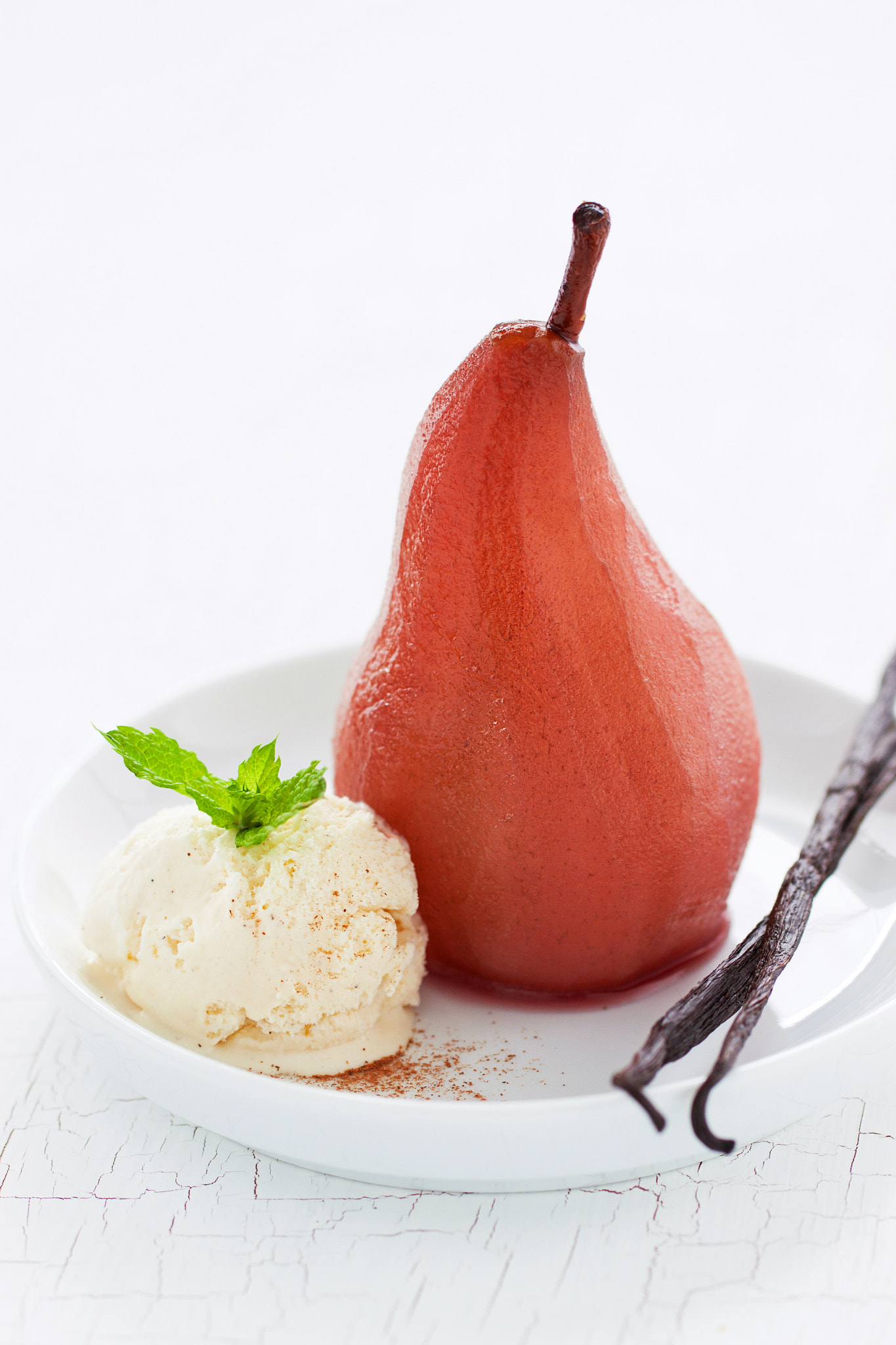 Canon EOS 50D + Canon EF 100mm F2.8L Macro IS USM sample photo. Homemade poached pear with vanilla ice cream, mint and vanilla sticks, closeup photography