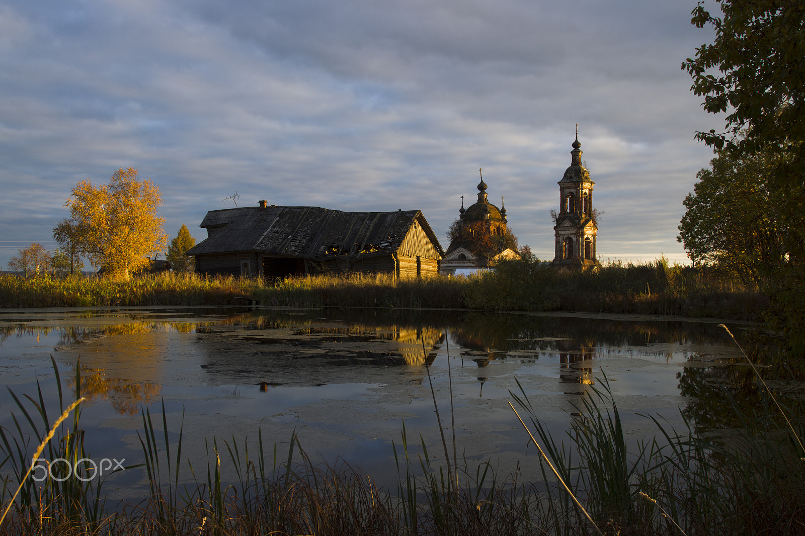 Canon EF 17-35mm f/2.8L sample photo. Autumn landscape with a pond, house and church photography
