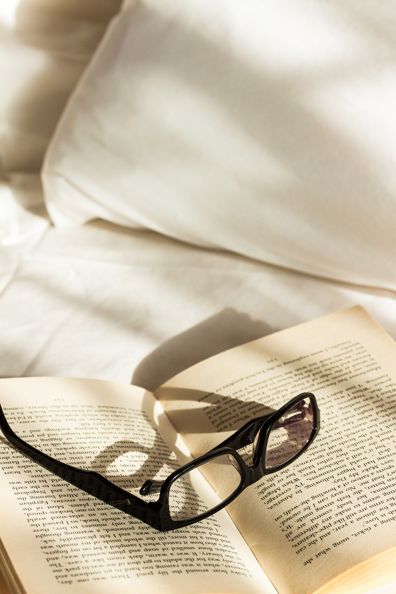 Canon EF-S 60mm F2.8 Macro USM sample photo. Glasses resting on a book on an unmade bed lit by morning sunshine photography