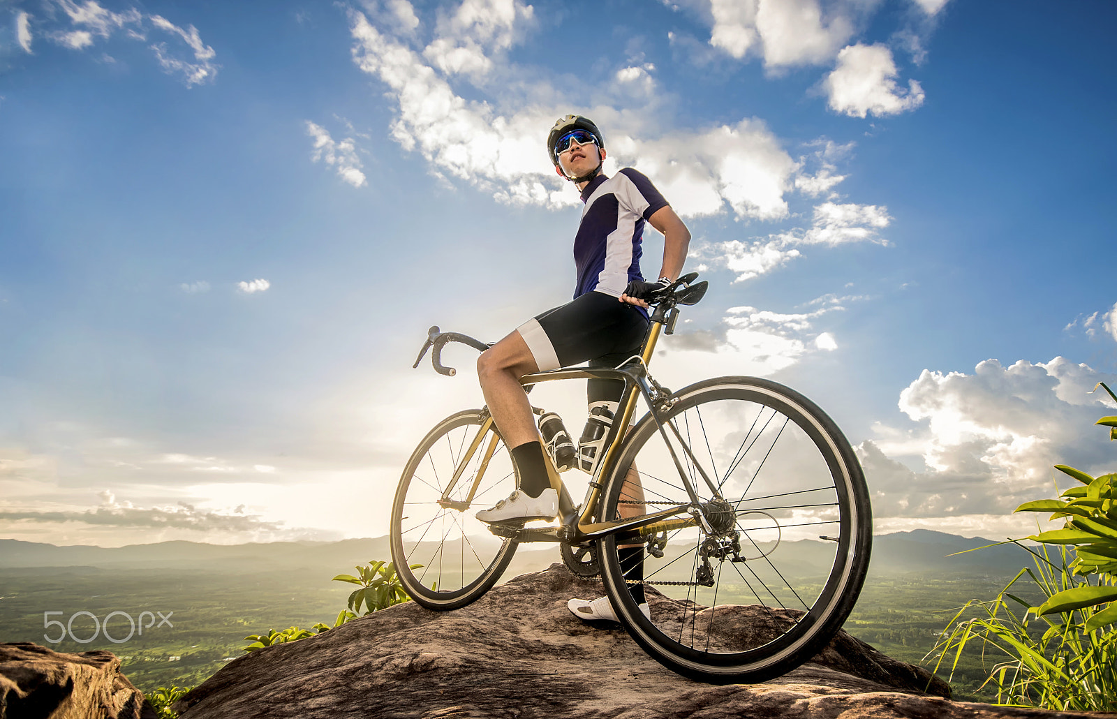 Nikon D750 sample photo. Young athlete standing on a rock with bicycle photography