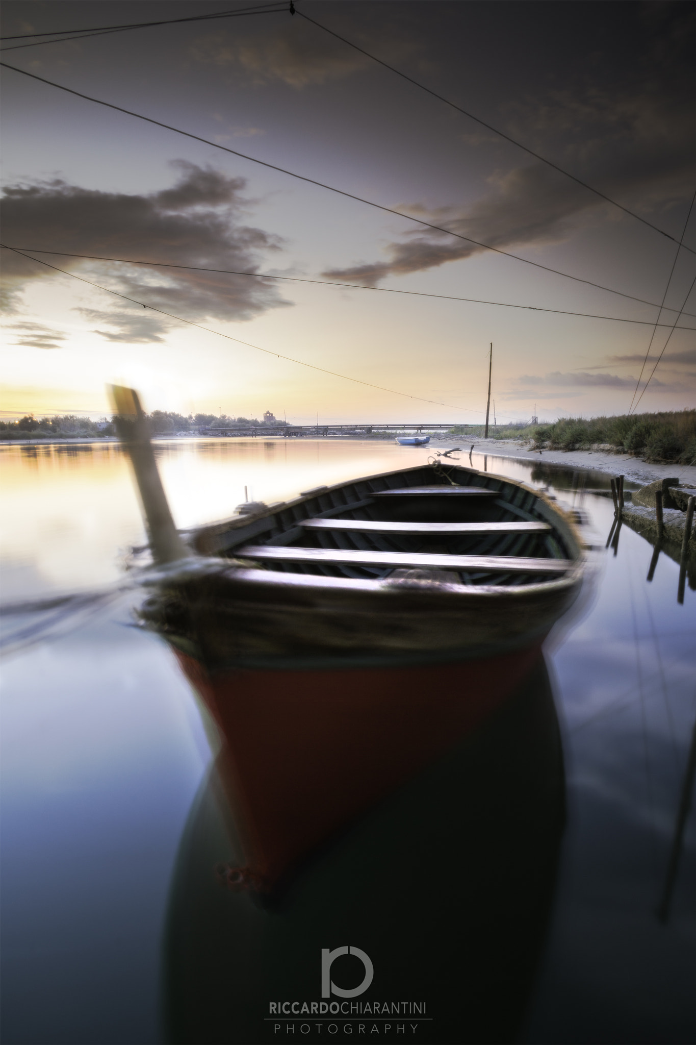 Canon EF 17-35mm f/2.8L sample photo. Red boat in tuscany river photography