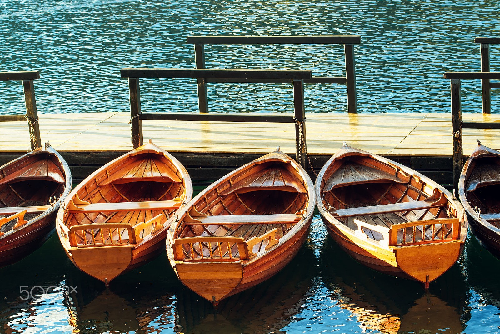 Nikon D600 sample photo. Small wooden boats docked and tied to empty pier photography
