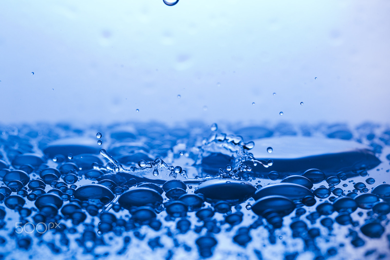 Canon EF 100mm F2.8L Macro IS USM sample photo. Drops, sprays, splashes of water on a colorful background photography