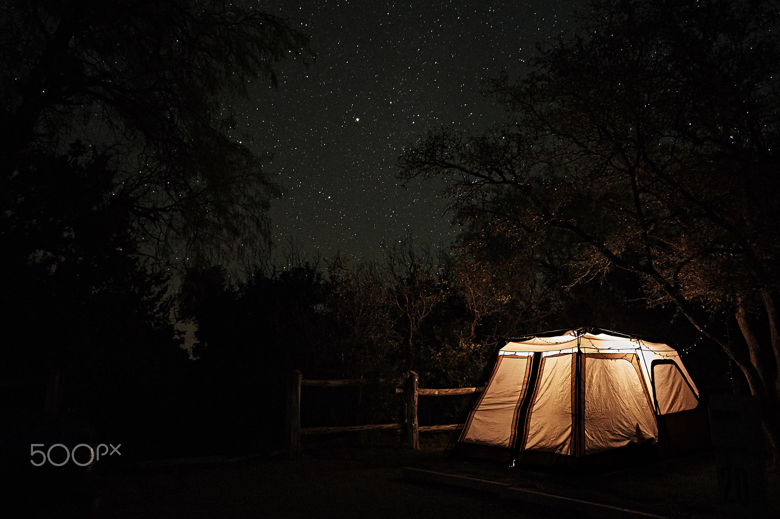 Sony a6000 + Sony E 18-55mm F3.5-5.6 OSS sample photo. Stars over a glowing tent photography