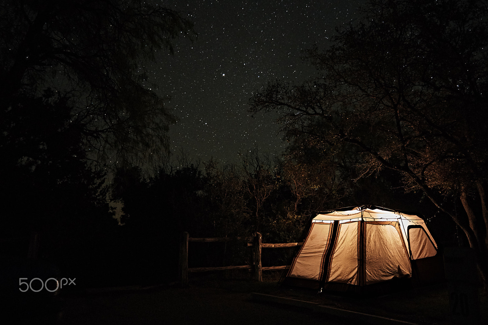Sony E 18-55mm F3.5-5.6 OSS sample photo. Stars over a glowing tent photography