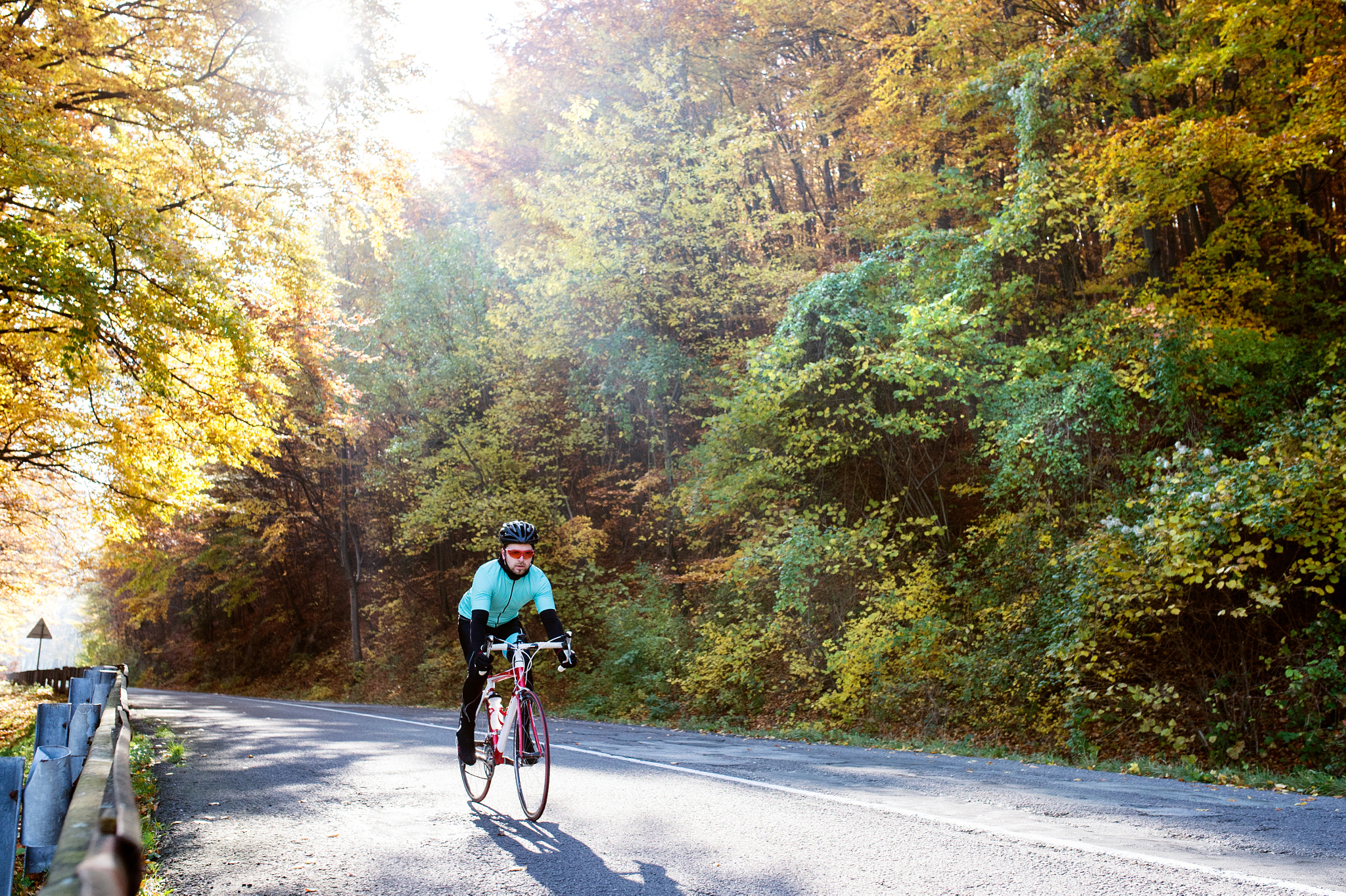 Nikon D4S sample photo. Young sportsman riding his bicycle outside in sunny autumn natur photography
