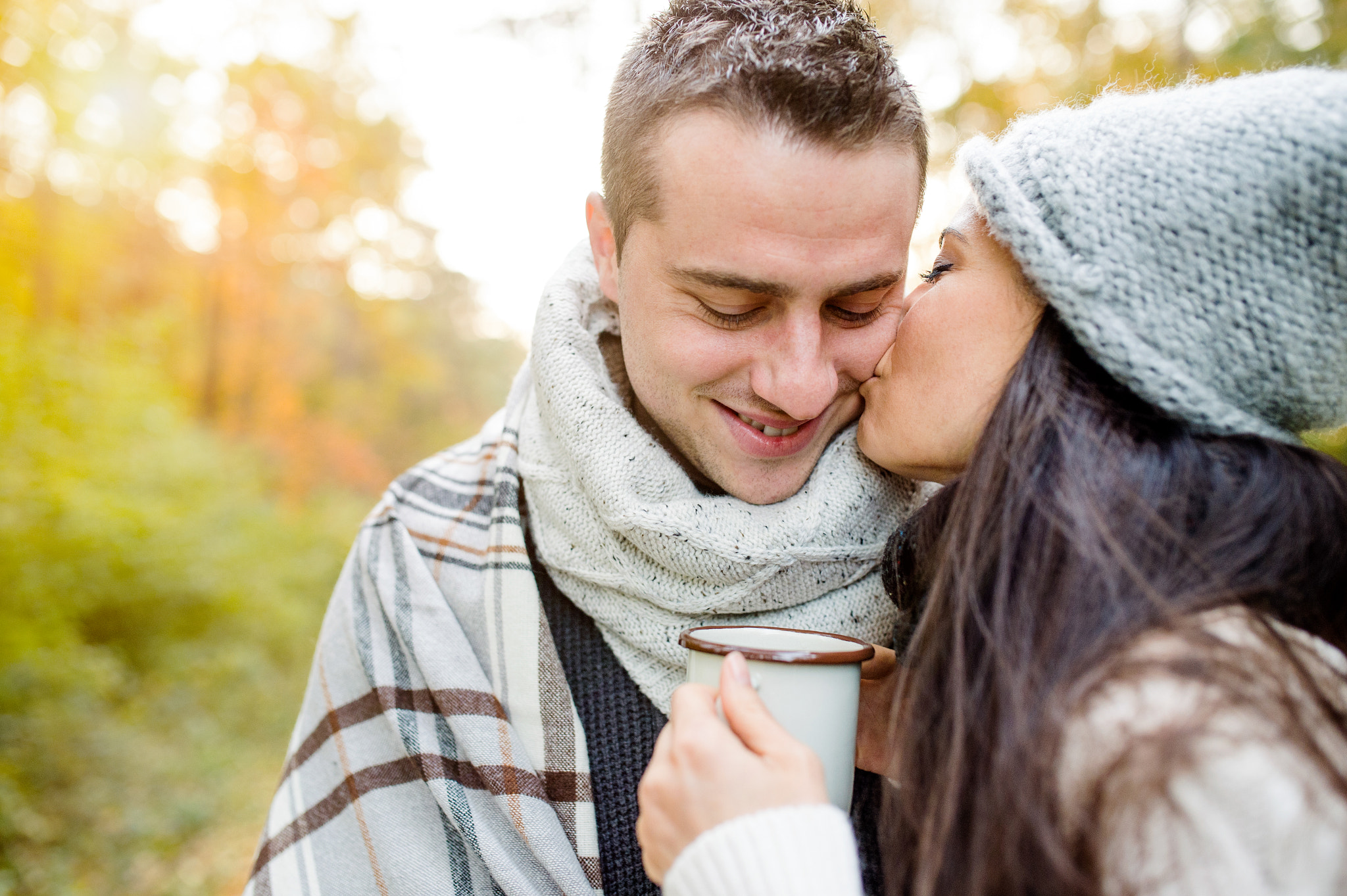 Nikon D4S + Sigma 35mm F1.4 DG HSM Art sample photo. Beautiful young couple hugging and kissing. sunny autumn nature. photography