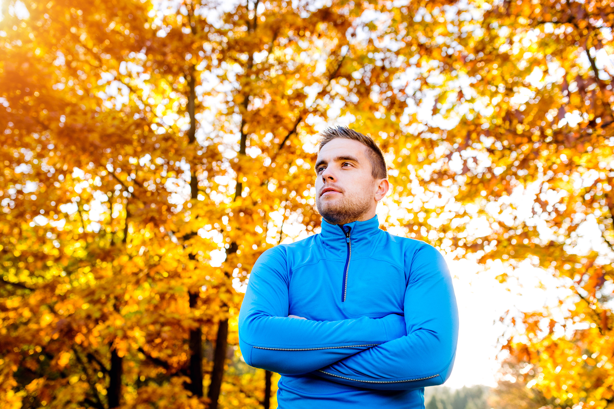 Nikon D4S + Sigma 35mm F1.4 DG HSM Art sample photo. Young handsome hipster runner outside in sunny autumn nature photography