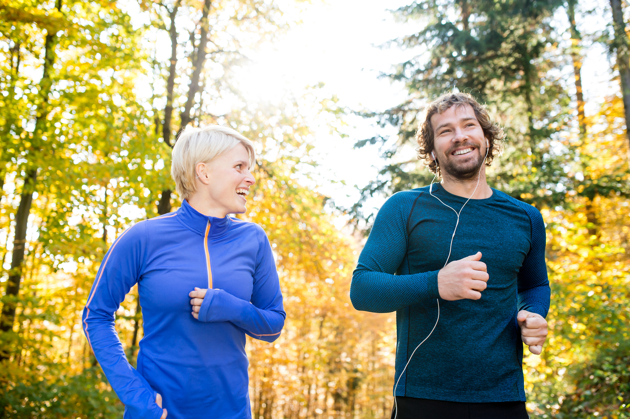 Nikon D4S + Sigma 35mm F1.4 DG HSM Art sample photo. Beautiful couple running outside in sunny autumn forest photography