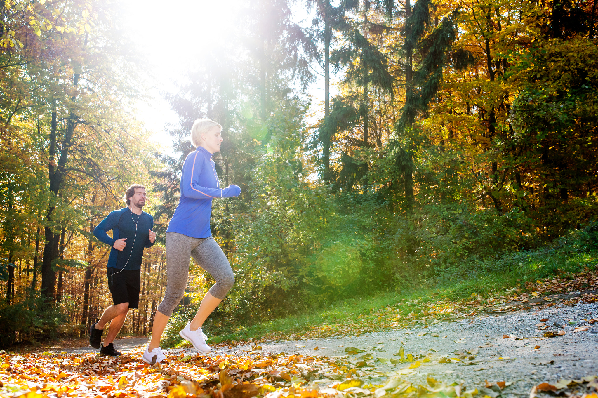 Nikon D4S + Sigma 35mm F1.4 DG HSM Art sample photo. Beautiful couple running outside in sunny autumn forest photography