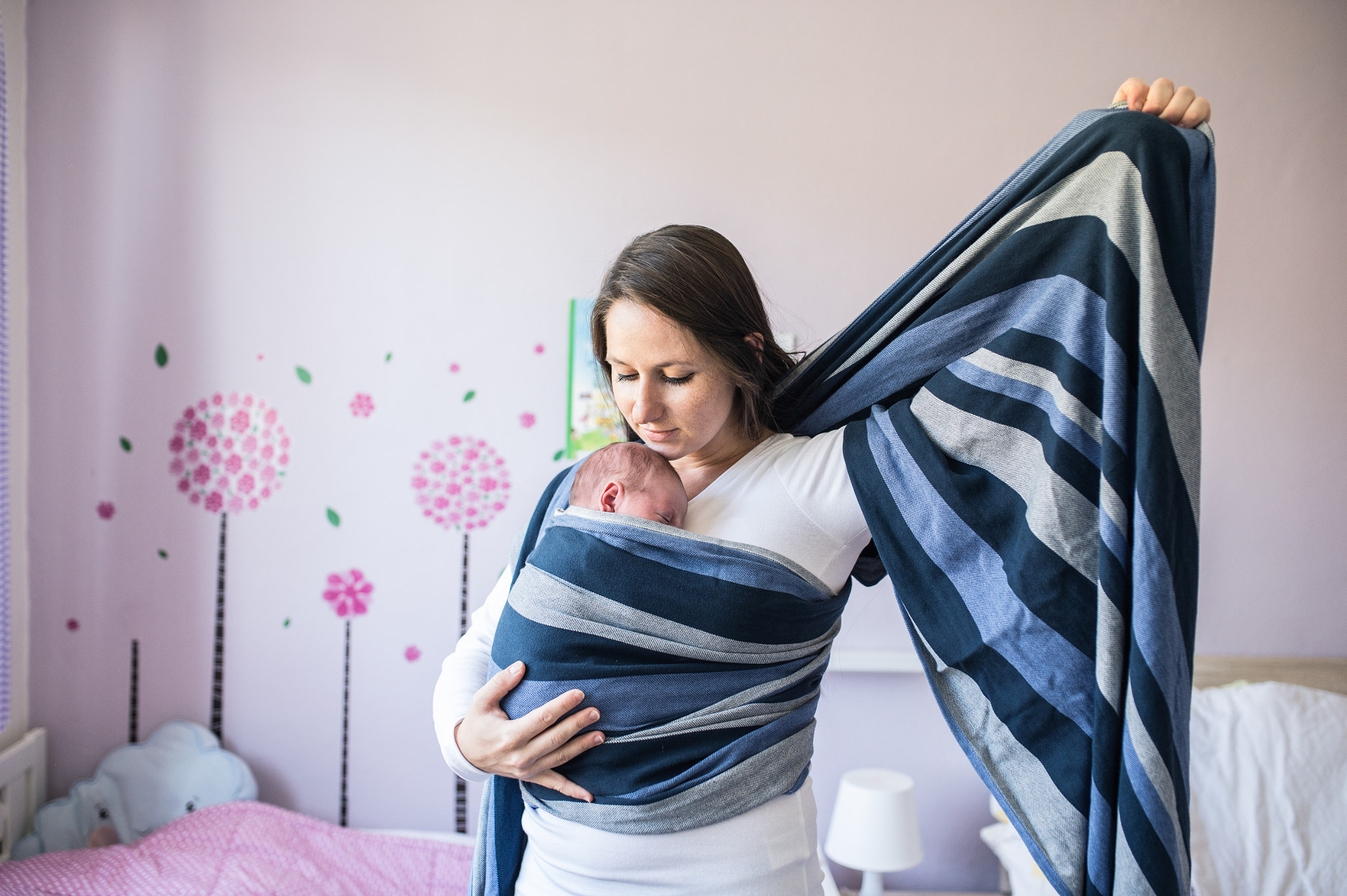 Nikon D4S + Sigma 35mm F1.4 DG HSM Art sample photo. Beautiful young mother wrapping her son into sling photography