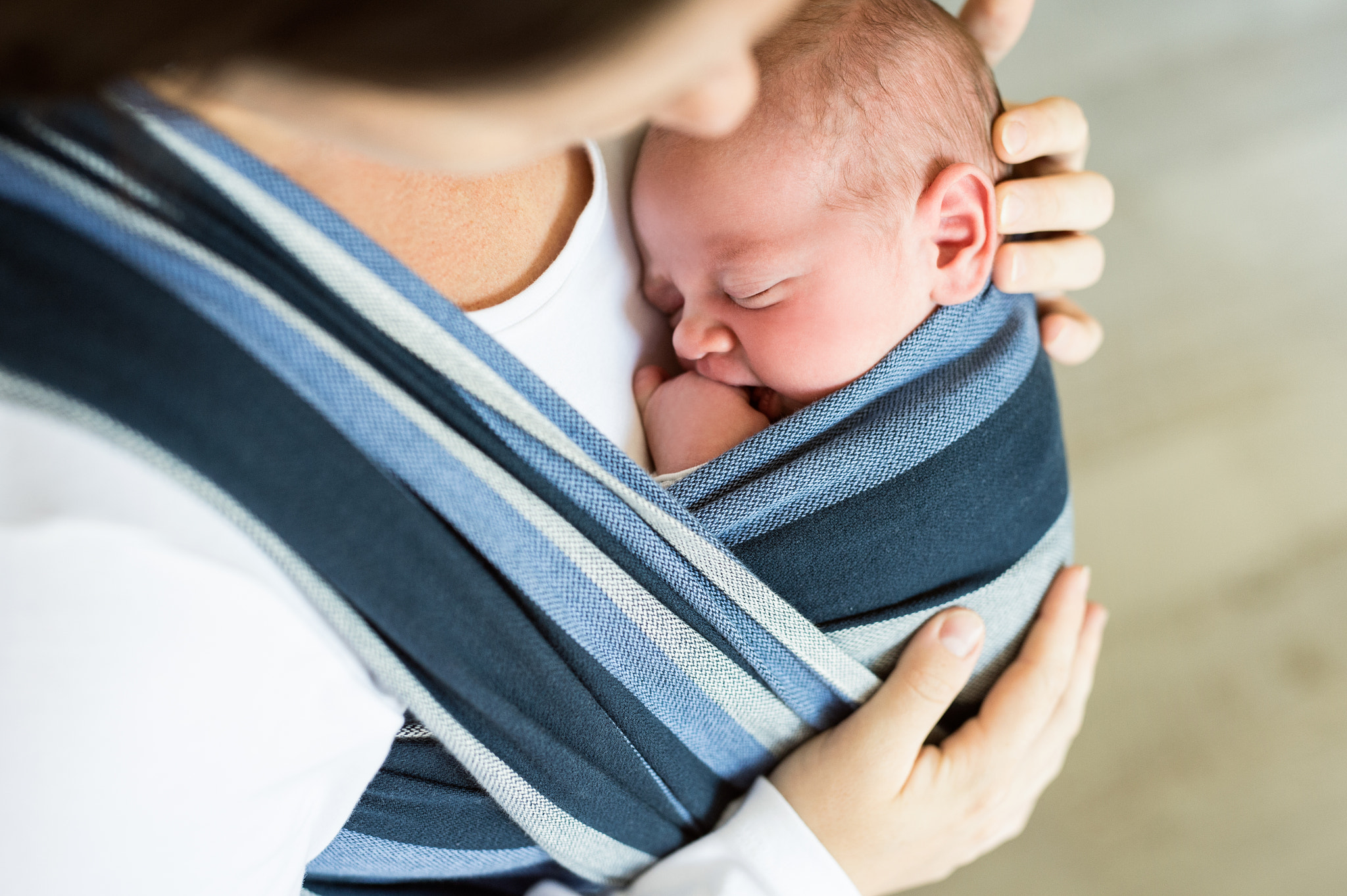 Nikon D4S + Sigma 50mm F1.4 DG HSM Art sample photo. Unrecognizable young mother with her son in sling photography