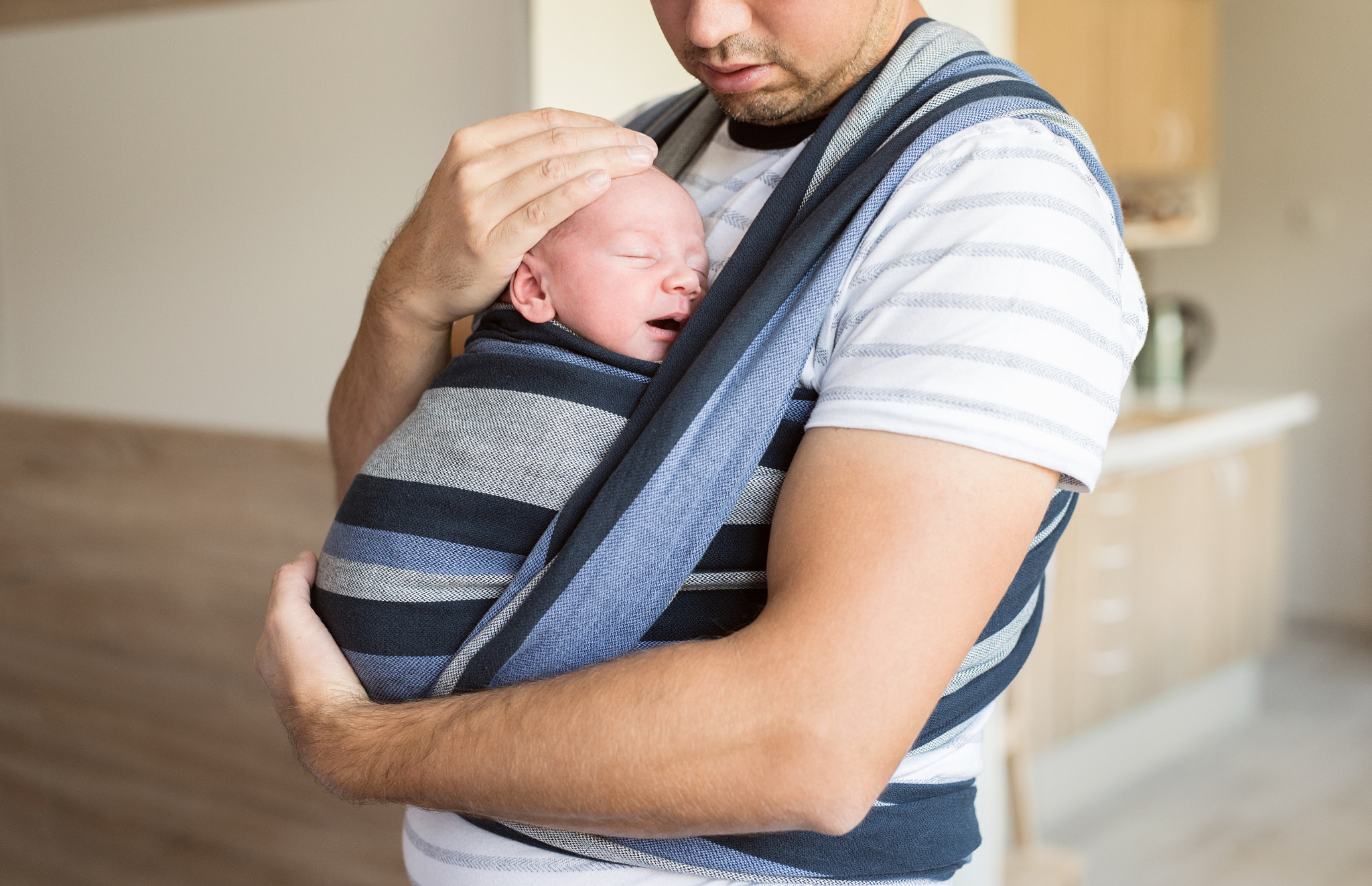 Nikon D4S + Sigma 50mm F1.4 DG HSM Art sample photo. Unrecognizable young father with his son in sling photography
