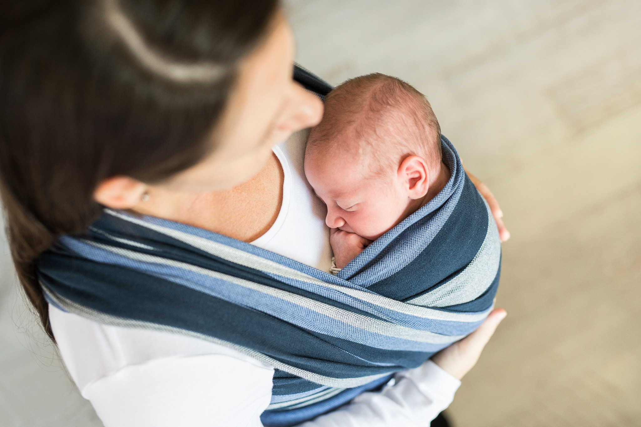 Nikon D4S + Sigma 50mm F1.4 DG HSM Art sample photo. Unrecognizable young mother with her son in sling photography