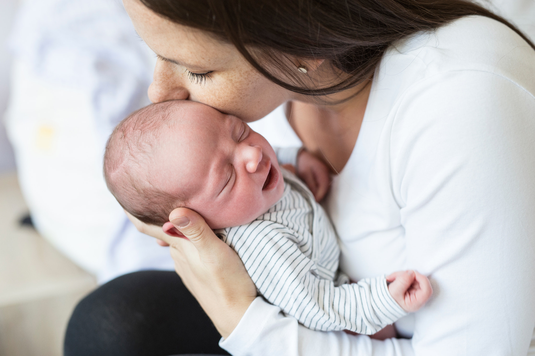 Nikon D4S sample photo. Beautiful young mother with her newborn baby son, bedroom photography