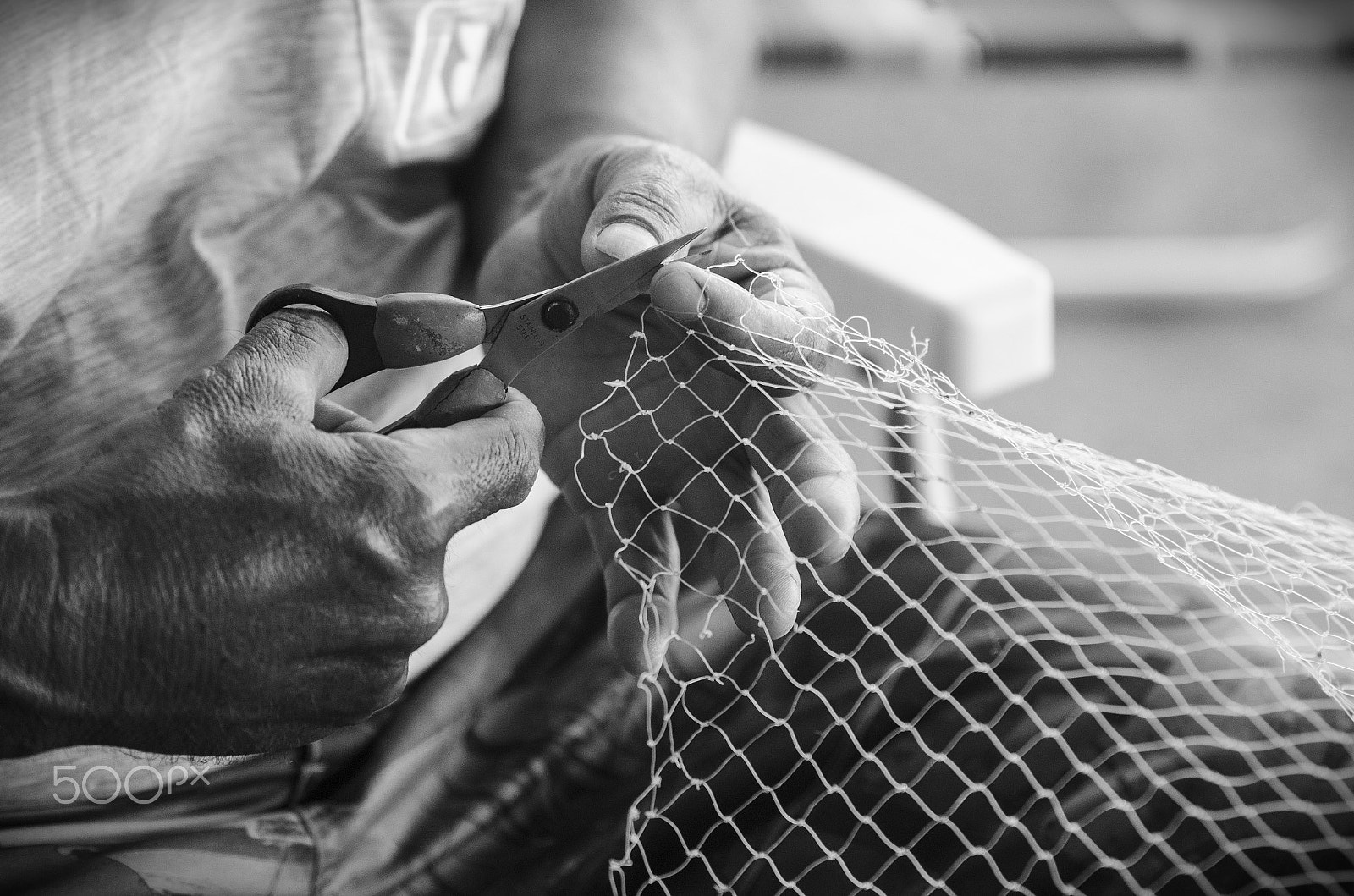 Sigma 70-200mm F2.8 EX DG Macro HSM II sample photo. Mending a fishing net photography