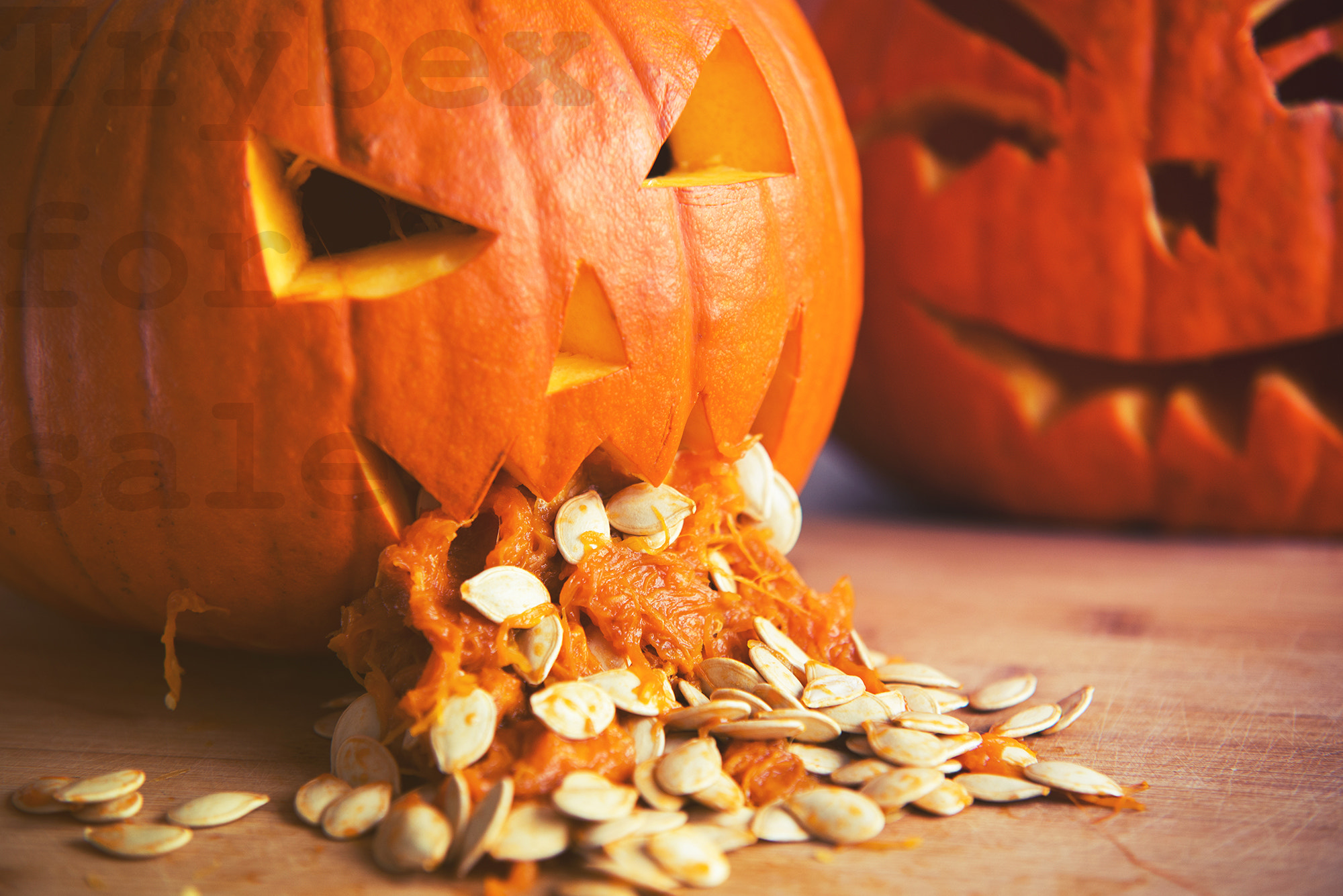 Nikon D610 sample photo. Pumpkin puking with pumpkin seeds on wood table photography
