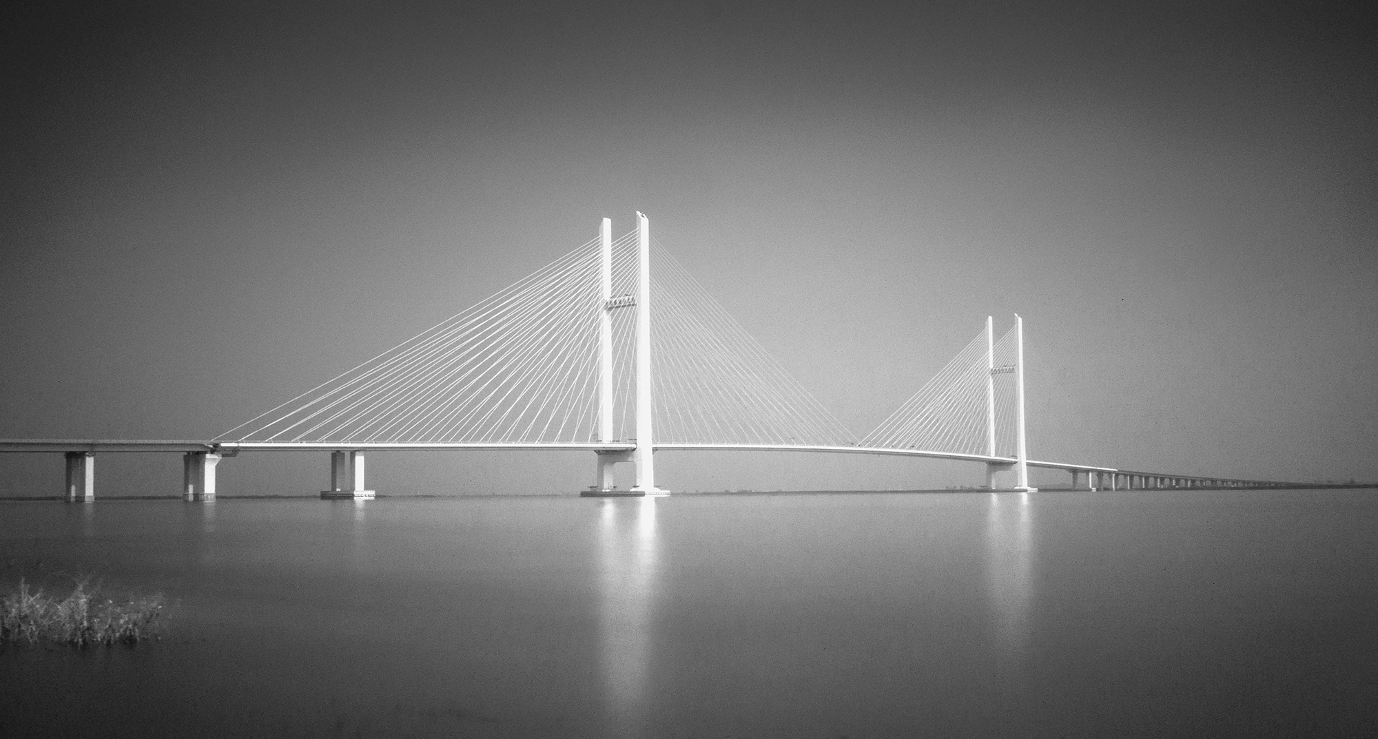 Panasonic Lumix DMC-GF1 + Panasonic Lumix G 14mm F2.5 ASPH sample photo. Yalu river bridge between china and north korea photography