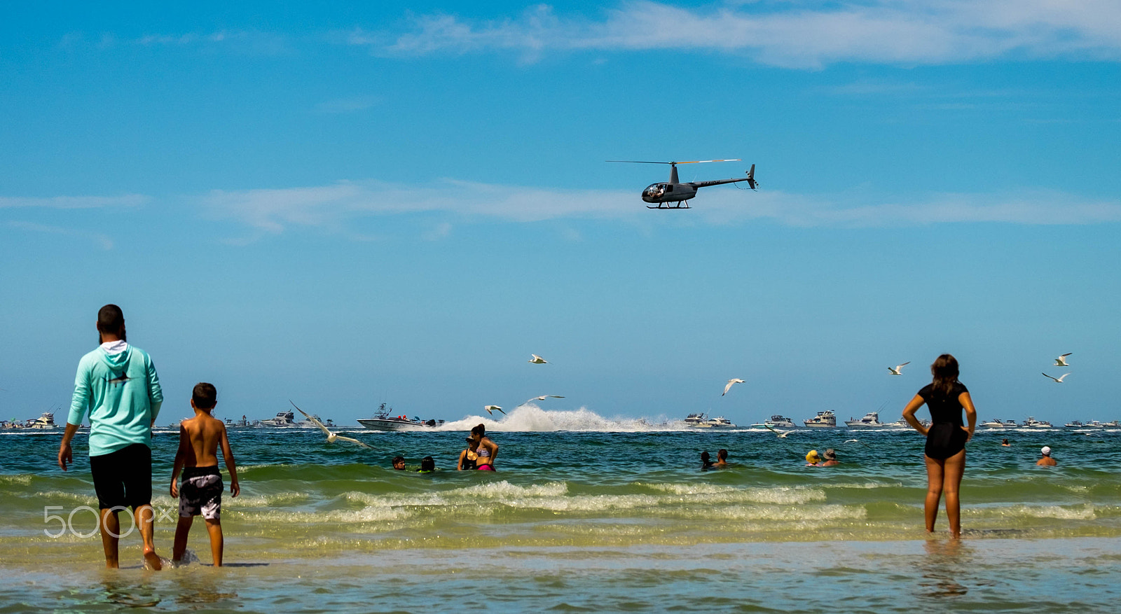 Fujifilm X-T1 sample photo. People watching the race, beachside photography