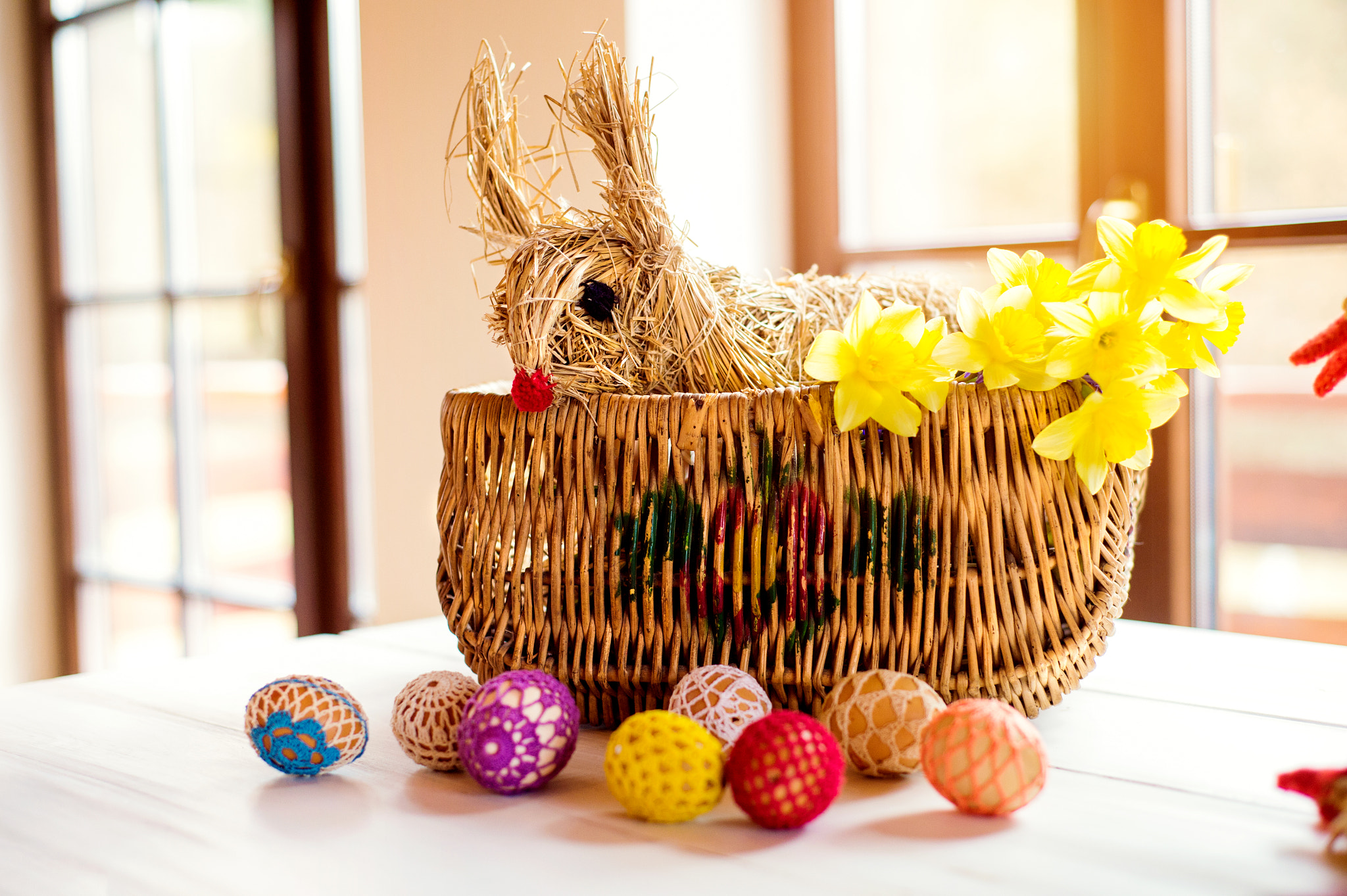 Nikon D4S sample photo. Wicker basket, straw easter bunny and daffodils, crocheted eggs photography