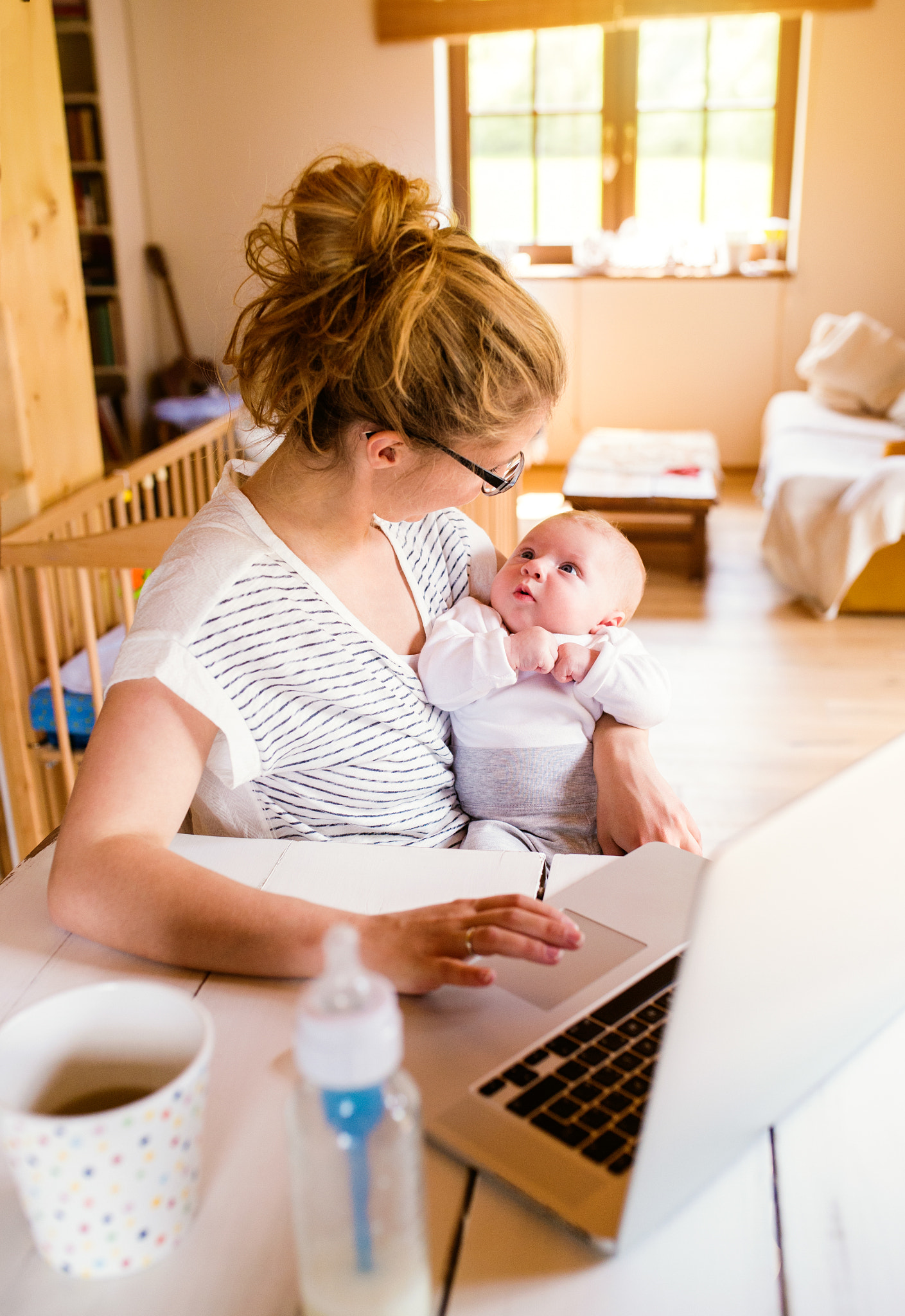 Nikon D4S + Sigma 35mm F1.4 DG HSM Art sample photo. Beautiful mother holding baby son, milk in bottle, close up photography