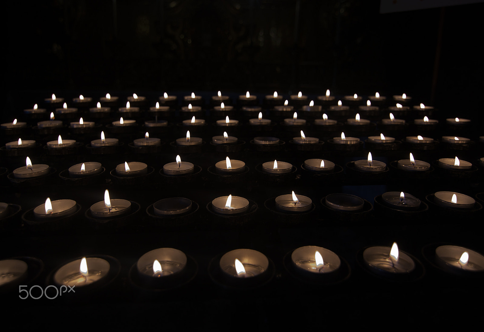Nikon D7100 sample photo. Prayer tealights in darkness photography