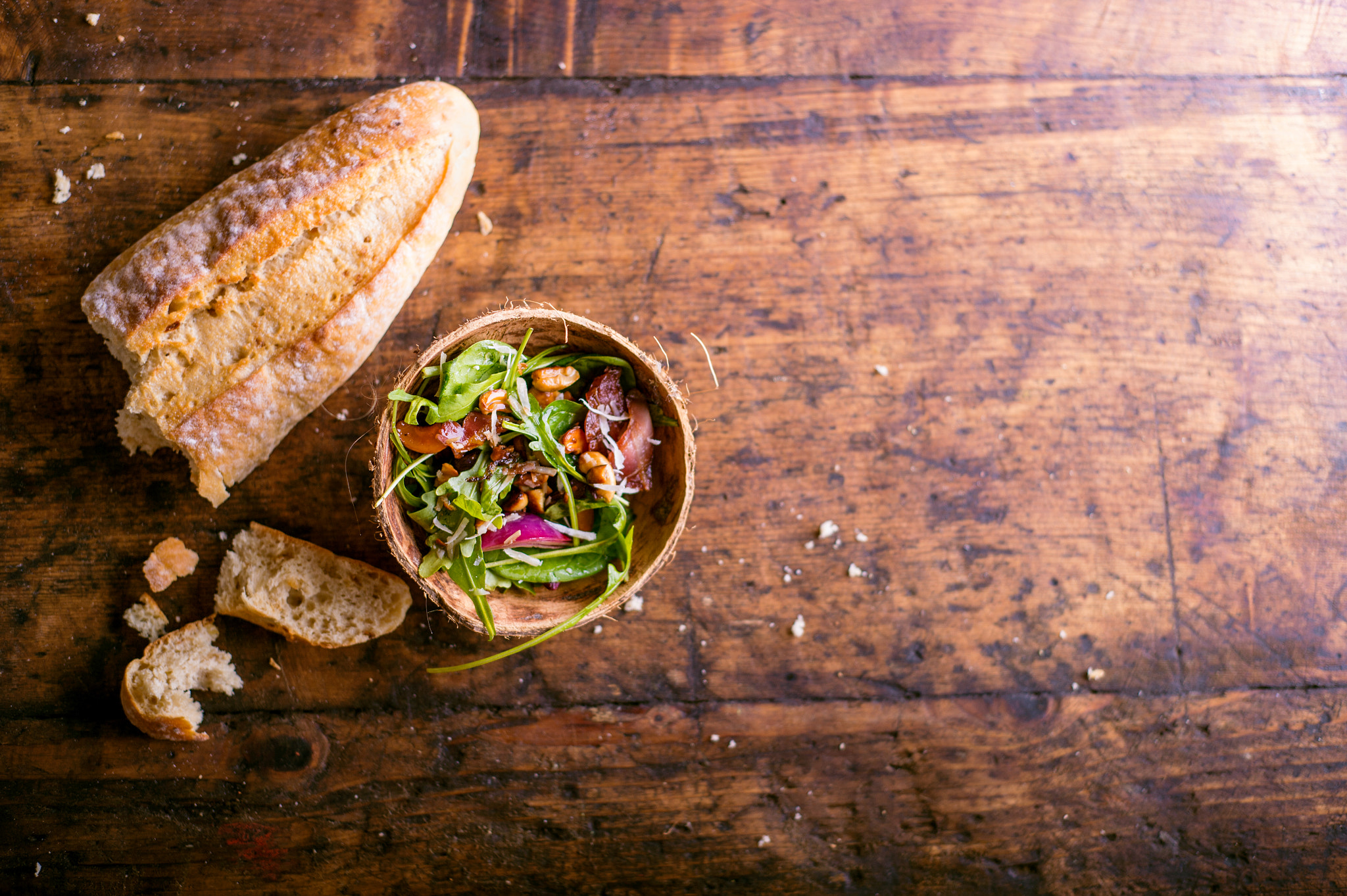 Nikon D4S sample photo. Rucola salad in bowl and loaf of bruschetta bread photography
