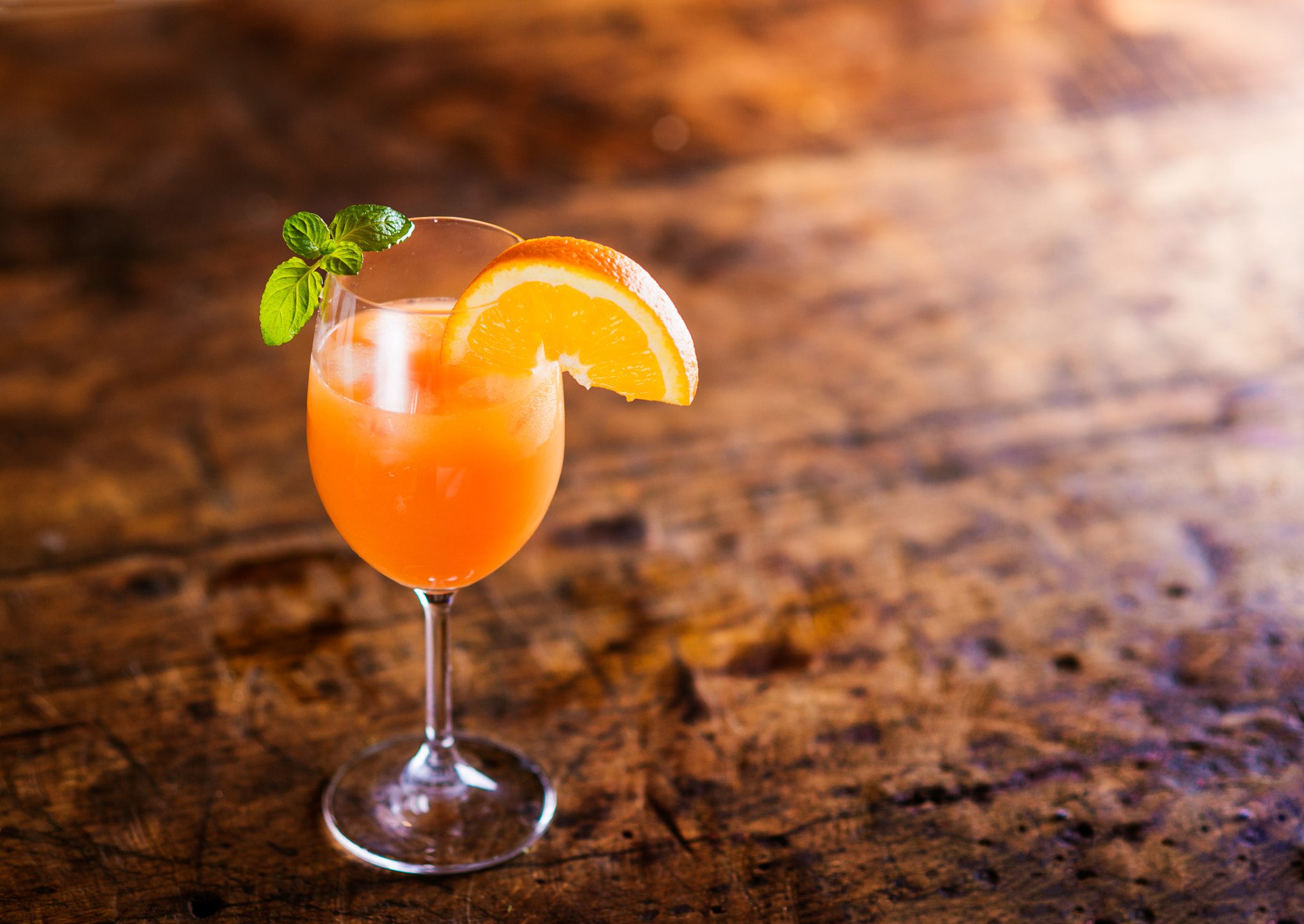 Nikon D4S + Nikon AF Nikkor 85mm F1.8D sample photo. Orange juice in glass with mint and fresh fruit photography