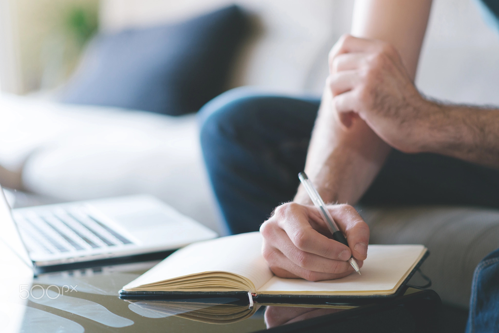 Hands of a man writing message