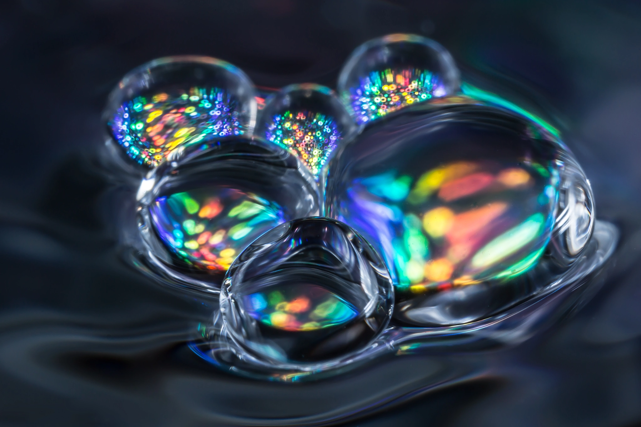 Canon MP-E 65mm F2.5 1-5x Macro Photo sample photo. Waterdroplets floating on water photography
