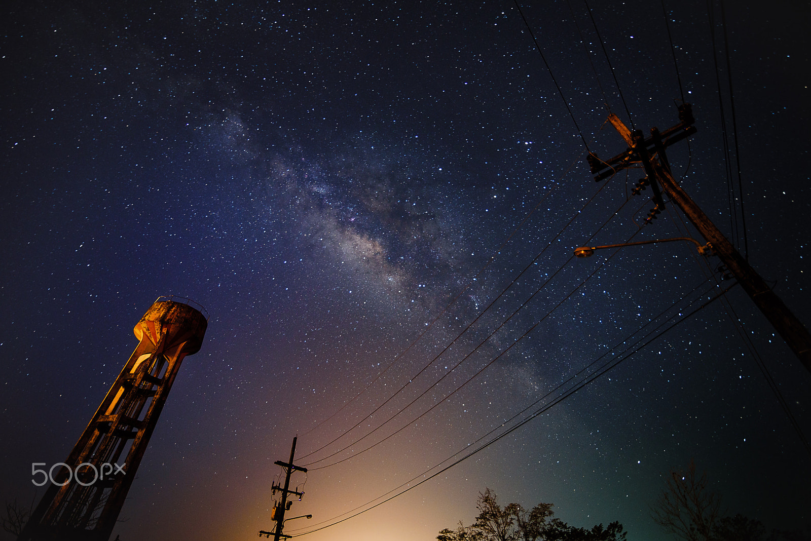 Tokina AT-X 16-28mm F2.8 Pro FX sample photo. Milkyway over water tower and electric line photography
