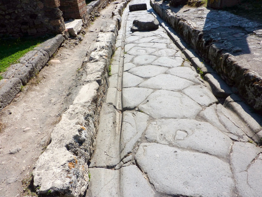 Panasonic DMC-ZS1 sample photo. Via dei sepolcri (street of tombs)). a long street with worn ruts from carts. pompeii italy photography