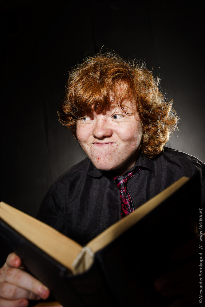 Sony a99 II + Tamron SP 24-70mm F2.8 Di VC USD sample photo. Freckled red-haired teenage boy reading book, education concept photography