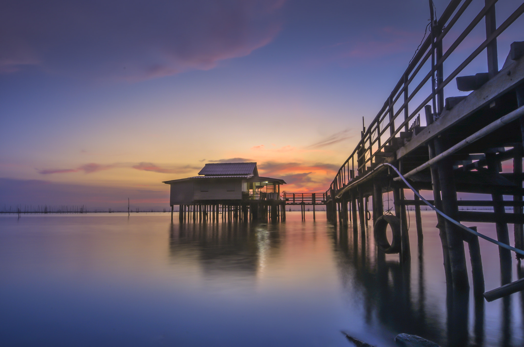 Nikon D90 sample photo. Twilight time on the lake with the lake house and wood bridge, songkhla lake, thailand photography