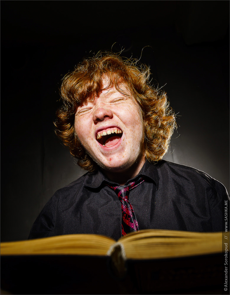 Sony a99 II sample photo. Freckled red-haired teenage boy reading book, education concept photography
