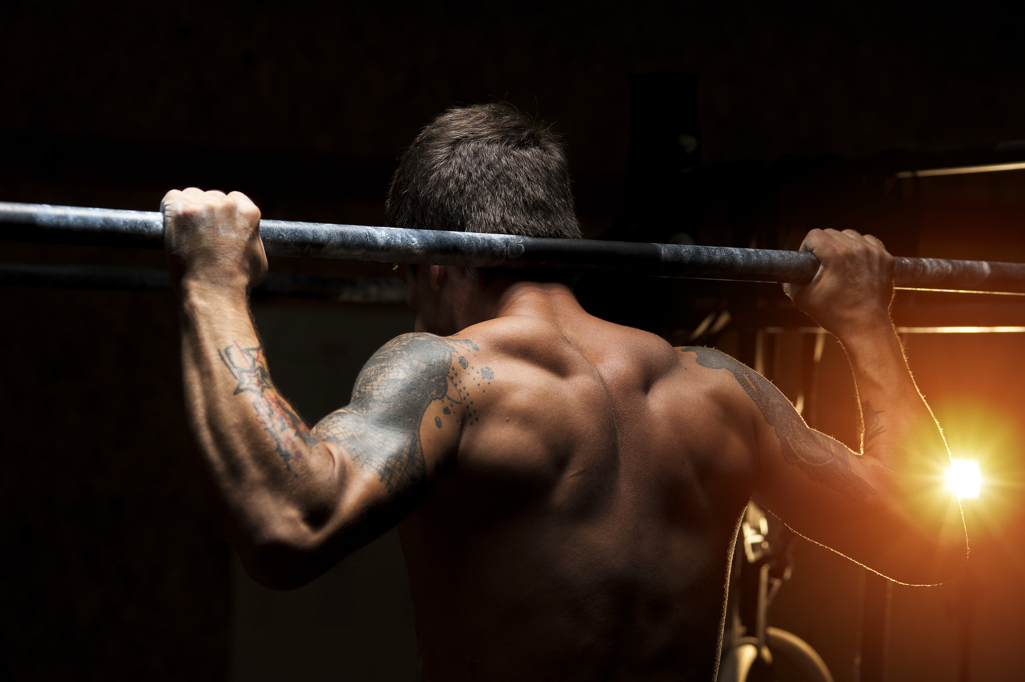 Nikon D700 + AF Micro-Nikkor 105mm f/2.8 sample photo. Athlete on horizontal bar photography