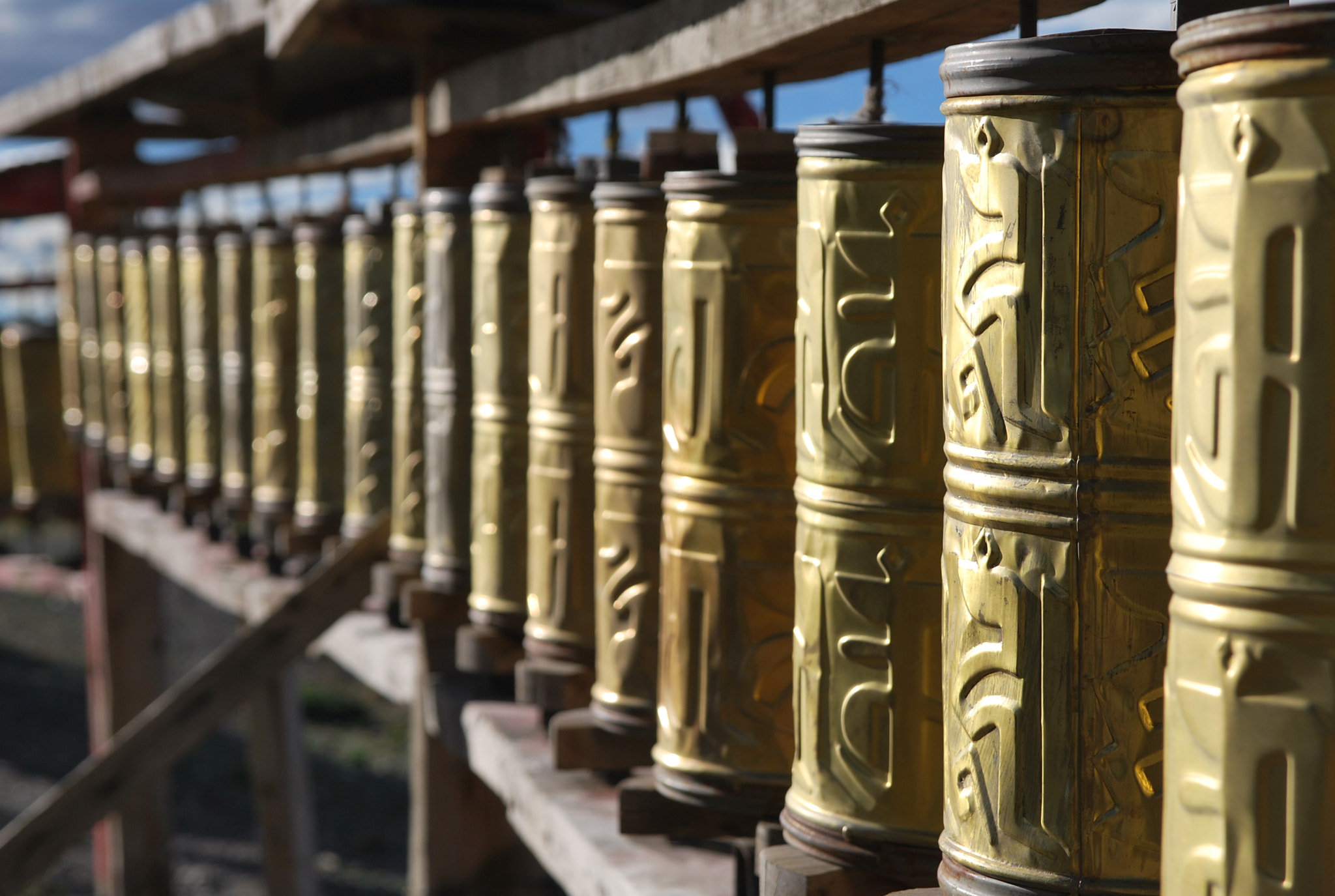 Sigma 17-70mm F2.8-4 DC Macro OS HSM sample photo. Prayer mills at tibetan countryside monetary photography