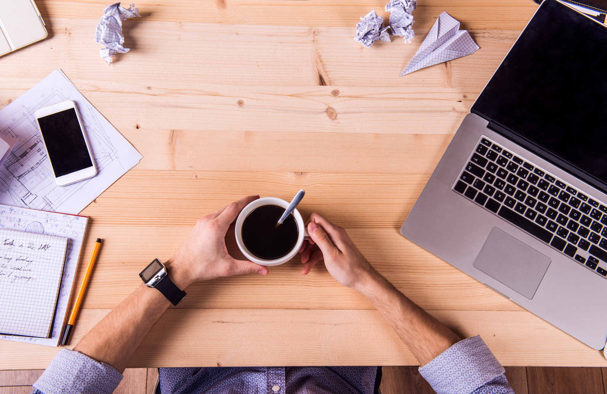 Businessman at the desk, office gadgets and supplies