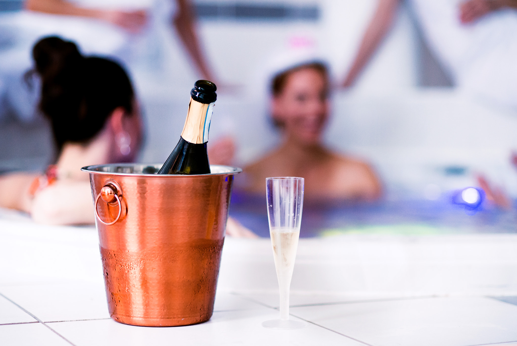 Nikon D4S + Nikon AF Nikkor 85mm F1.8D sample photo. Glass and bottle of champagne in bucket, hen party photography
