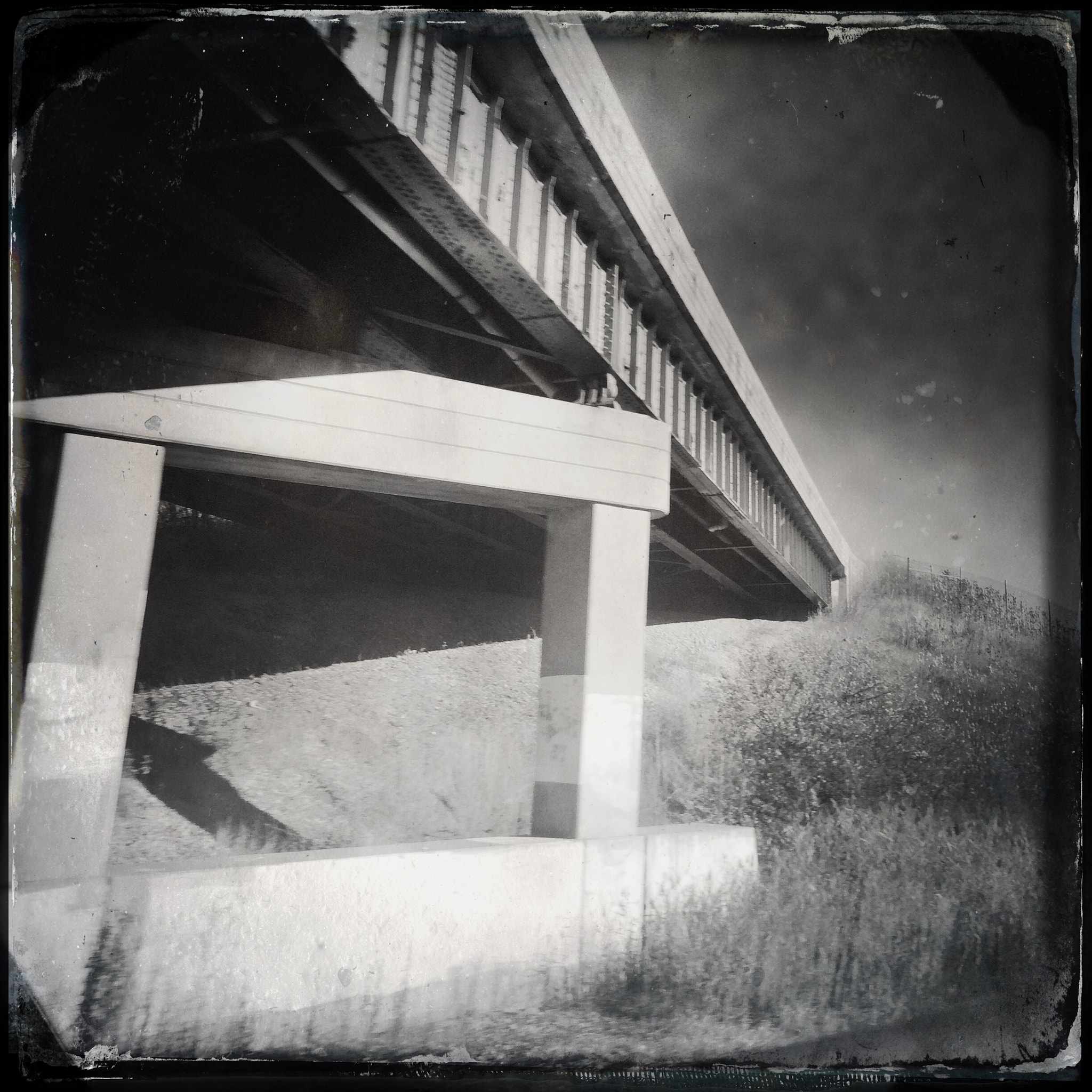 Hipstamatic 302 sample photo. Overpass taken from train window photography