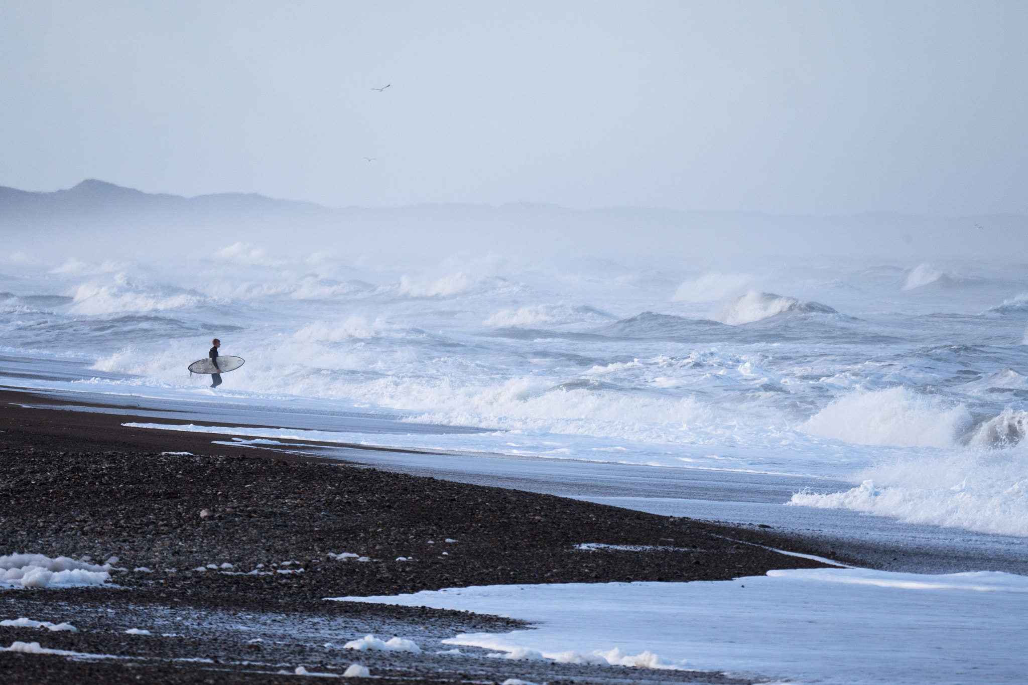 Panasonic Lumix DMC-GX8 + LEICA DG 100-400/F4.0-6.3 sample photo. Surfer confronted with chaos waves photography