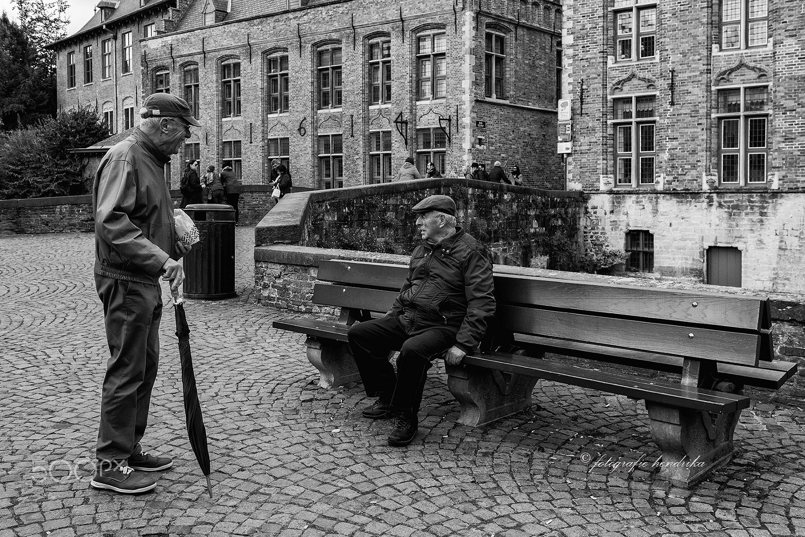 Nikon D800 + Nikon AF Nikkor 35mm F2D sample photo. Men talking to each other photography