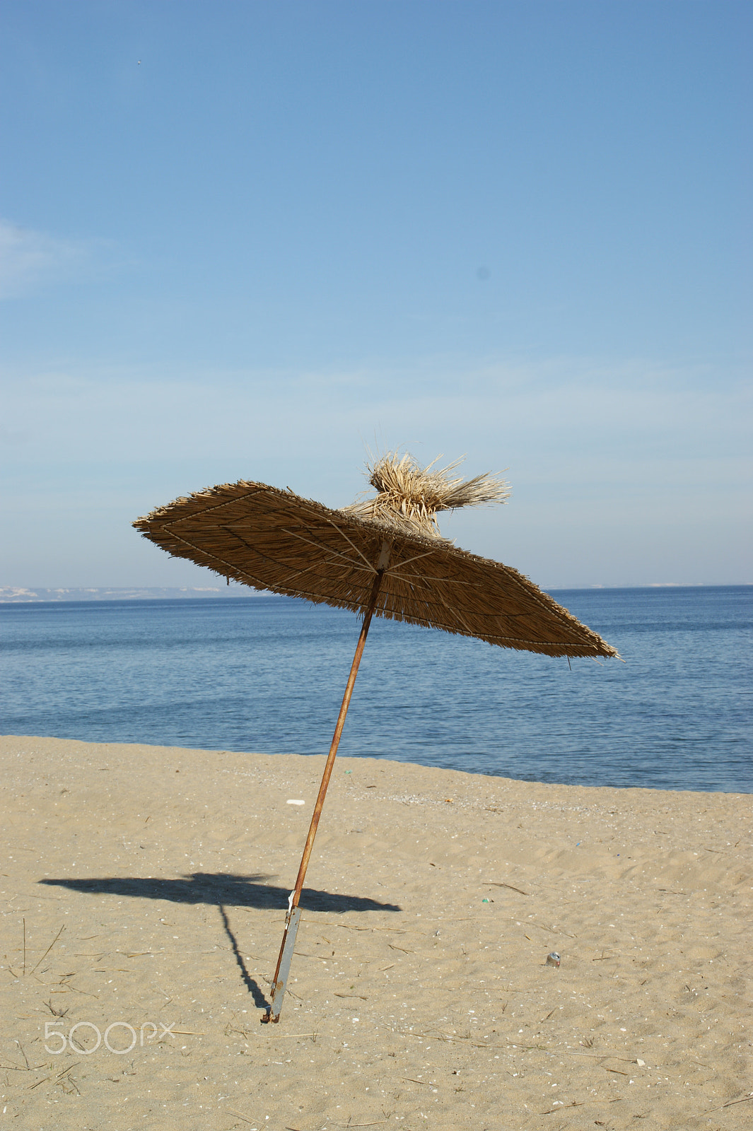Sony DT 18-200mm F3.5-6.3 sample photo. Lonely umbrella photography