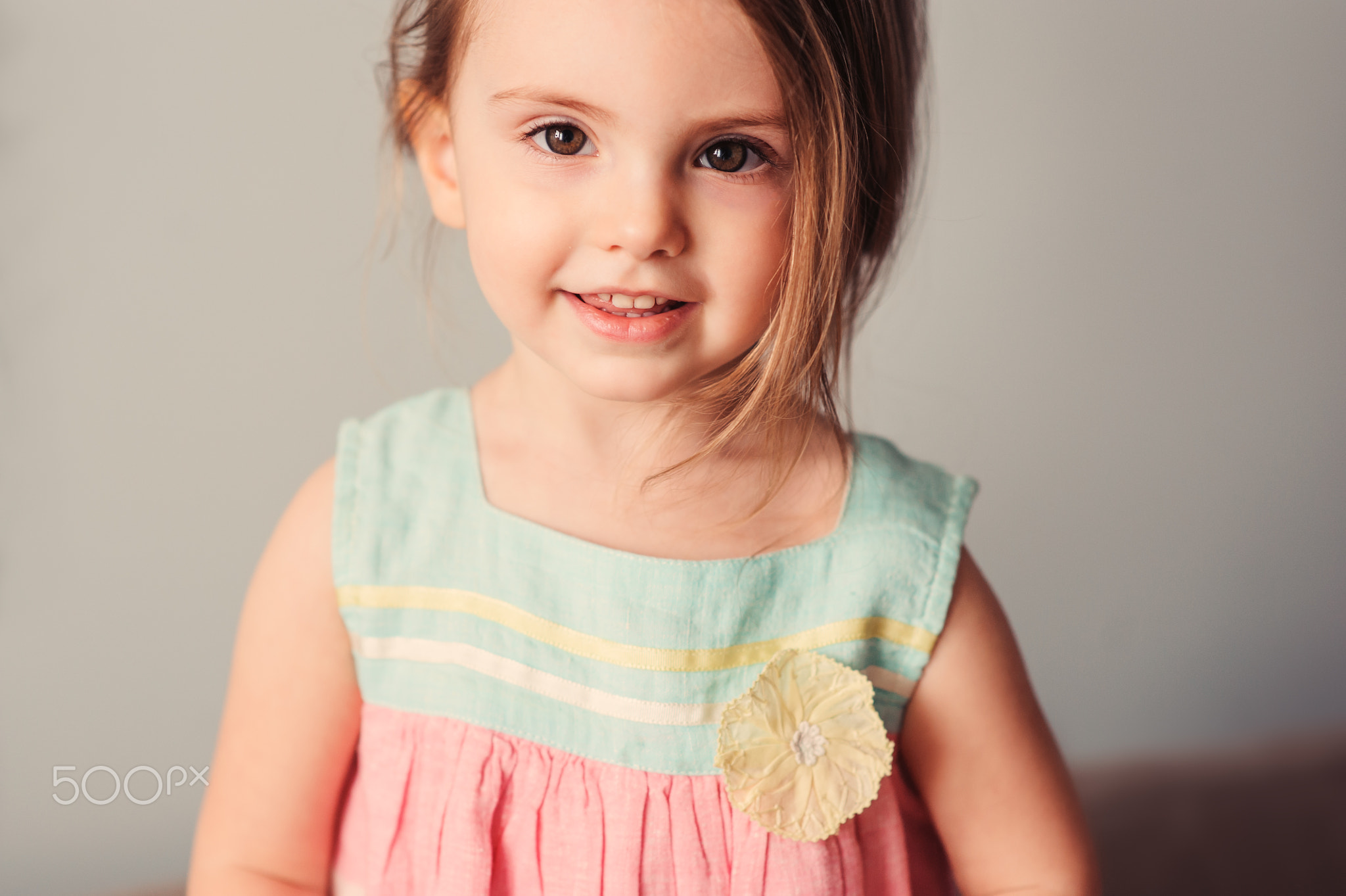 cute toddler girl playing at home on couch