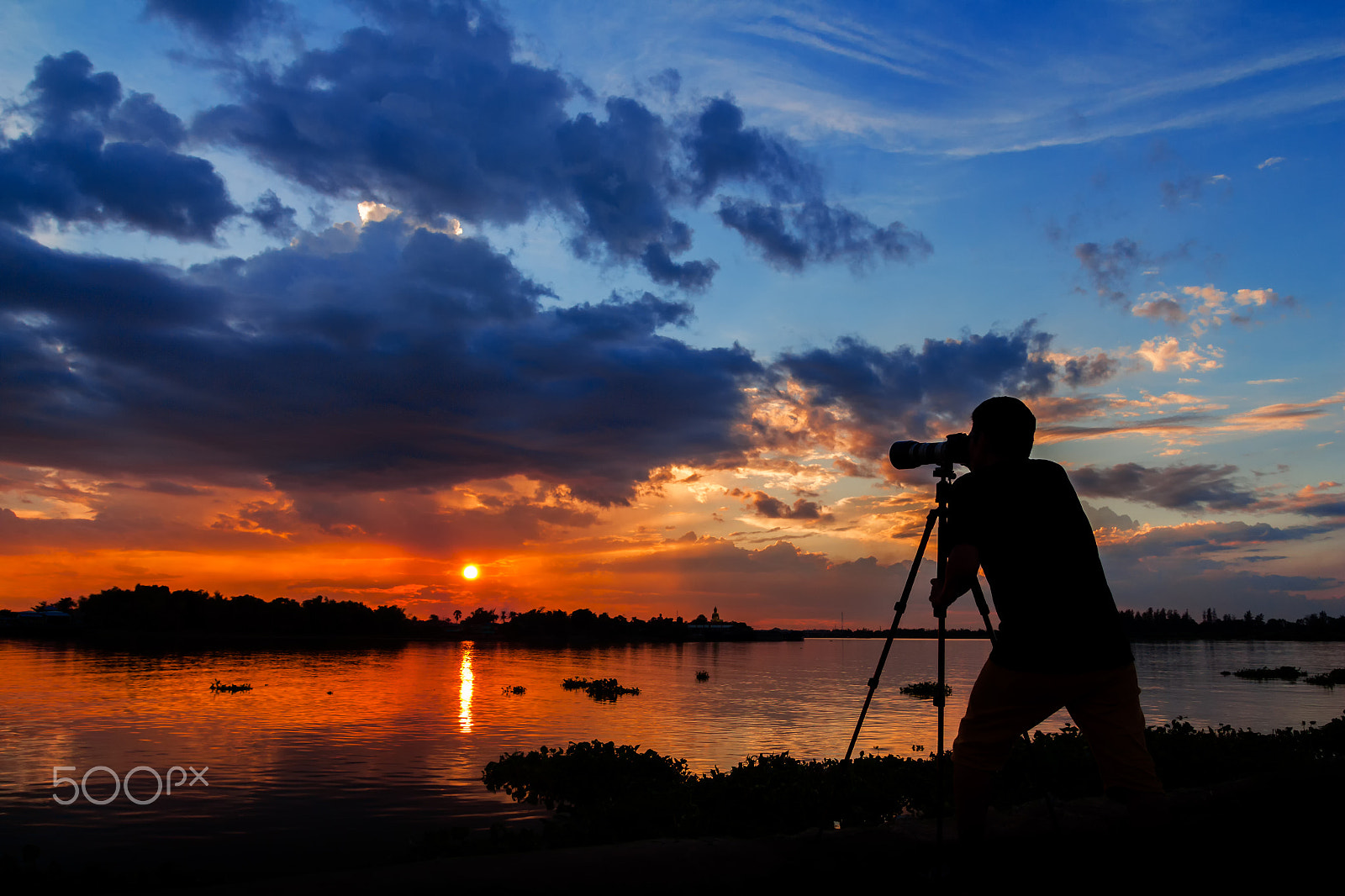 Tamron SP AF 17-50mm F2.8 XR Di II LD Aspherical (IF) sample photo. Silhouette of photographer taking photo at sunset beside the riv photography