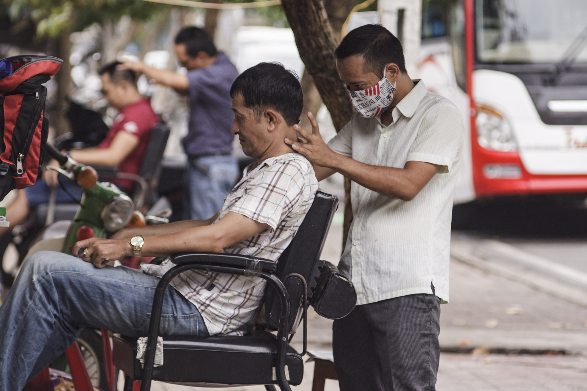 Canon EOS 50D sample photo. Getting a haircut on sidewalk-nhatrang vietnam photography