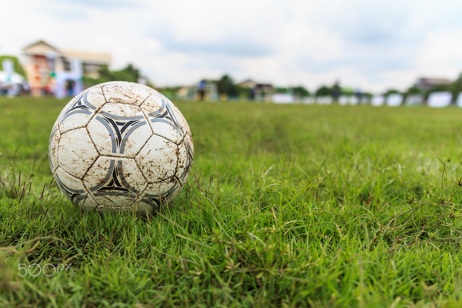 Canon EOS 7D sample photo. Muddy soccer ball on a football field photography