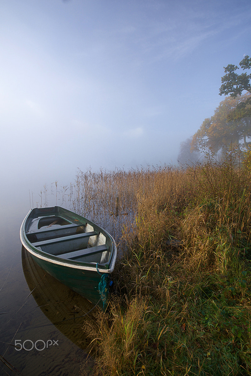 Sony ILCA-77M2 sample photo. Lone boat in mist photography