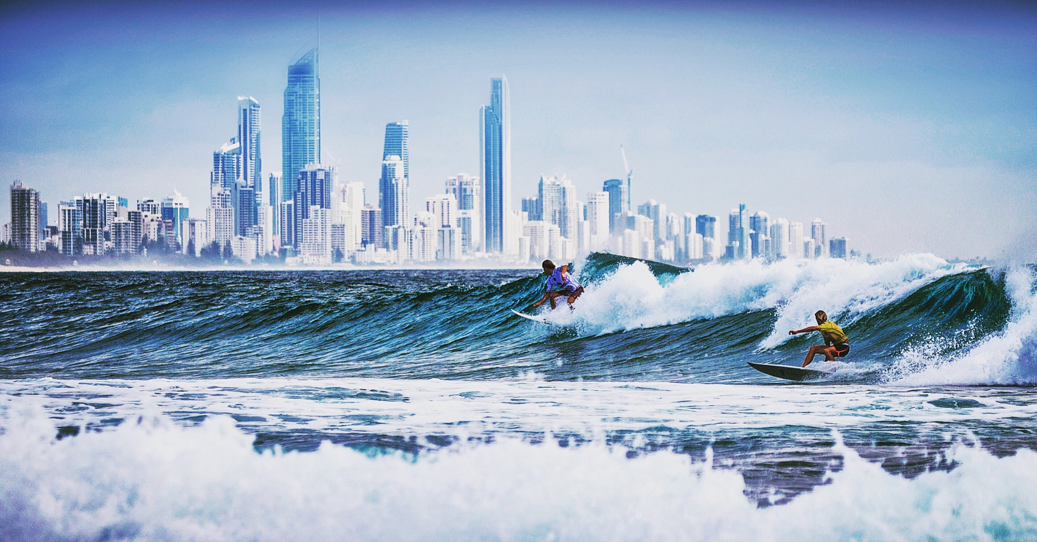 Canon EOS-1D Mark III sample photo. Surfers connecting with nature in the shadow of the modern world photography
